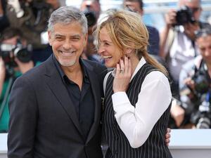 Julia Roberts (R) and George Clooney attend a Cannes International Film Festival photocall for "Money Monster" on May 12, 2016. File Photo by David Silpa/UPI