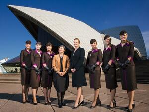 Etihad Airways flight attendants standing in front of the Sydney Opera House. (AFP/File)