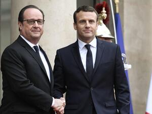 France's new President was greeted by his predecessor, François Hollande, outside the Elysee presidential palace 