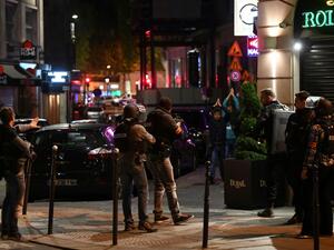 Police check passersby near the Champs Elysees in Paris after a shooting which left one officer dead and two wounded. (AFP/Franck Fife) 