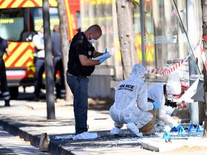 French forensic police search the site following a car crash on August 21, 2017, in the southern Mediterranean city of Marseille (AFP)