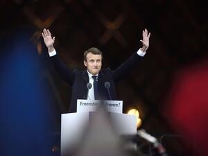 French president-elect Emmanuel Macron greets supporters as he arrives to deliver a speech in front of the Pyramid at the Louvre Museum in Paris on May 7, 2017, after the second round of the French presidential election. (AFP/Eric Feferberg)