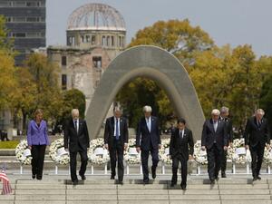 The G7 foreign ministers walk down the steps together after placing wreaths in front of the memorial in Hiroshima, Japan, on April 11, 2016. (AFP/Jonathan Ernst)