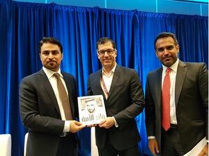 Bryan Buggey, Director, Strategic Initiatives and Sector Development, Vancouver Economic Commission, receiving a copy of the ‘Father of our Nation’ from Fahad Al Gergawi, CEO, Dubai FDI.