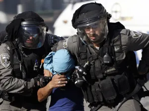 Israeli police arrest a Palestinian during clashes in Shuafat, an east Jerusalem refugee camp. (Ahmad Gharabli/AFP)