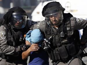 Israeli police arrest a Palestinian during clashes in Shuafat, an east Jerusalem refugee camp. (Ahmad Gharabli/AFP)