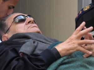 Mubarak is seen leaving court on a stretcher due to his poor health. (AFP/File)