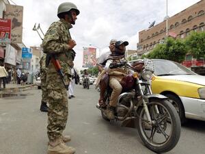 A Yemeni soldier loyal to the Shia Houthi movement checks cars in the capital Sanaa, May 25, 2015. (AFP/File)