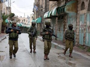 IDF soldiers are seen on patrol in Hebron. (AFP/File)