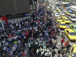 Iranian protesters gather at the grand Bazaar in Tehran on June 25, 2018, shouting slogans and throwing rocks in the streets before being dispersed by anti-riot policemen. (AFP/ File)