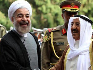 Iranian President Hassan Rouhani, left, greets the Emir of Kuwait, Sheikh Sabah Al-Ahmad Al Sabah in Tehran on June 1, 2014 (AFP/Atta Kenare)
