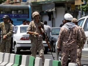 Members of the Iranian Revolutionary Guard secure the area outside the Iranian parliament during an attack on the complex in the capital Tehran on June 7, 2017. (AFP/Hossein Mersadi)