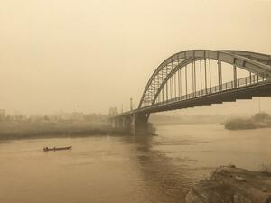 A picture taken on February 18, 2017 shows a general view of a bridge in the Iranian city of Ahvaz during a sandstorm. At least seven people were killed as floods, avalanches and dust storms gripped the country, state media reported. (AFP/Morteza Jaberian)