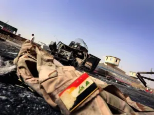 Jacket belonging to an Iraqi Army uniform lies on the ground (AFP/File Photo)	