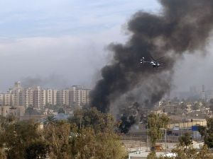 A Blackwater helicopter circles the site of a car bombing in Baghdad, 2004 (Wikimedia Commons)