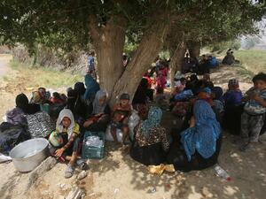 Displaced Iraqi civilians wait to receive assistance after fleeing Fallujah. (AFP/File)