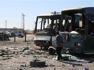 An Iraqi man walks near the site of a previous car bomb in Baghdad. (AFP/File)