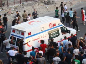 An Iraqi ambulance leaves during a protest against the government and the lack of basic services outside the regional government headquarters in the southern city of Basra on September 5, 2018. (Haidar MOHAMMED ALI / AFP)