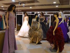 Evening wear and wedding dresses are displayed in a showroom in Mosul, Iraq. (AFP/ File Photo)