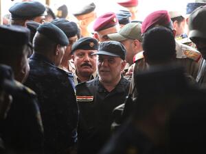 Iraqi Prime Minister Haider al-Abadi (C) arrives in the al-Tayaran neighborhood of Mosul on July 9, 2017 to meet with military commanders after the government's announcement of the "liberation" of the embattled city. (Ahmad Al-Rubaye/AFP)