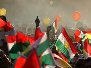Iraqi Kurds fly Kurdish flags during an event to urge people to vote in the upcoming independence referendum in Irbil. (Safin Hamed/AFP)