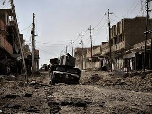Iraqi special forces drive through a heavily damaged street in Mosul, on March 1, 2017. (AFP)