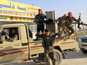 Peshmerga fighters gathering at the Altun Kubri checkpoint, 40kms from Kirkuk, on October 20, 2017 (Marc-Antoine Pelaez/AFP)