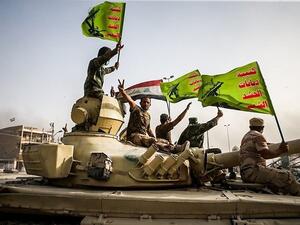 Militia fighters from the Popular Mobilization Forces celebrate a victory against Daesh, June 2016 (Wikimedia Commons)