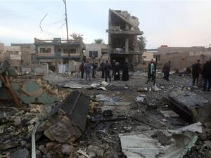 People gather at the site of a bomb attack in eastern Baghdad, Iraq. (AFP/ File Photo)