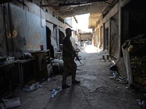 A member of Iraq's elite Counter-Terrorism Service patrols an alley during the advance towards the Old City of Mosul on June 19, 2017 as the ongoing offensive continues to retake the last district still held by Daesh fighters. (Mohamed El-Shahed/AFP)