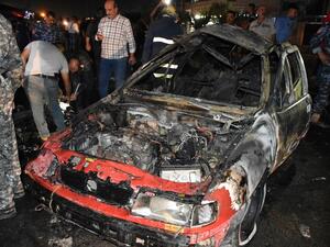 Iraqi security forces inspect the scene of a car bomb explosion that targeted a shop selling alcohol in the mainly Kurdish Iraqi city of Kirkuk on September 16, 2017. (Marwan Ibrahim/AFP)