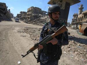 An Iraqi policeman stands at a checkpoint in the Old City of Mosul on March 14, 2018, eight months after Iraqi government forces retook the city from the control of the Daesh terror group. (AFP/ File Photo)