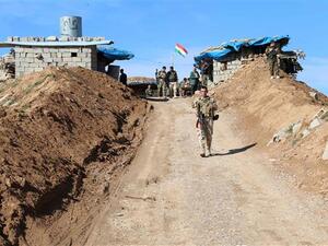 A picture taken on Jan. 11, 2016 shows Kurdish Peshmerga forces monitoring trenches in Daquq in Kirkuk. (AFP)