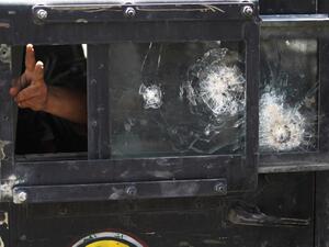 A member of the Iraqi Counter-Terrorism Service (CTS) flashes the victory sign from the window of a humvee during an advance in the old city of Mosul on July 5, 2017, as the Iraqi government forces continue their offensive to retake the city from Islamic State (IS) group fighters. (Ahmad al-Rubaye/AFP)