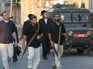 مستوطنون مسلحون في الضفة الغربية