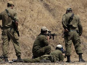 Israeli soldiers take part in target training in the Golan Heights on September 6, 2016. (AFP/Jalaa Marey)