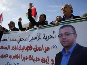 Journalists, prisoners held two separate rallies in support of Palestinian hunger-striker Al-Qiq on Thursday. (AFP/File)