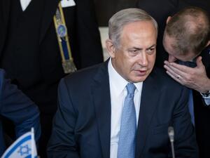 Israel's Prime Minister Benjamin Netanyahu listens to an advisor during his meeting as part of his visit to the Netherlands at the Binnenhof, in the Hague, on September 7, 2016. (AFP/Bart Maat)