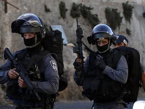 A resident of Beersheba in his thirties was arrested on Sunday for allegedly rigging plastic bottles with small cameras to illegally help people pass Israel's written theoretical driving examination. (AFP/ File Photo)