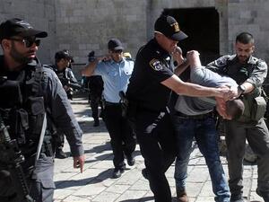 Israeli forces arrest a Palestinian man after Friday prayers at the entrance of Damascus Gate outside the Old City of al-Quds. (AFP/ File)
