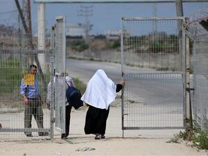 Palestinians pass through the Erez crossing near Beit Hanun in the northern Gaza Strip on August 27, 2018. (AFP/File)