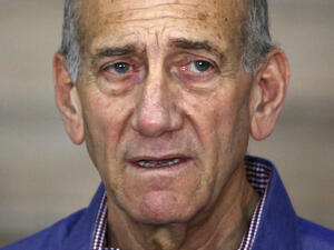 Olmert began serving a 19-month sentence in February 2016, which was later extended to a 27-month sentence.(AFP) 