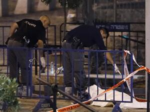 Israeli forensic police check the body of a suspected Palestinian assailant outside Damascus Gate in Jerusalem's Old City on June 16, 2017 following an attack. (Thomas Coex/AFP)