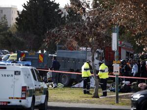 Israeli security forces gather around a flatbed truck at the site of a ramming attack in Jerusalem on January 8, 2017. (AFP/Ahmad Gharabli)