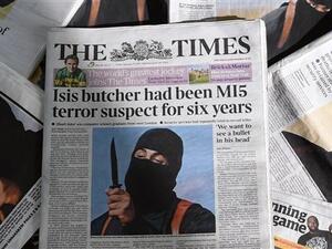 A file picture taken on February 27, 2015, shows an arrangement of British daily newspapers photographed in London showing the front-page headlines and stories regarding the identification of the masked ISIL militant dubbed "Jihadi John". AFP Photo