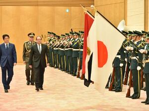 Egypt's President Abdel Fattah al-Sisi and Japan's Prime Minister Shinzo Abe review an honour guard during Sisi's four-day visit to Japan. (AFP/Kazuhiro Nogi)