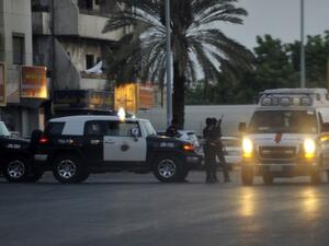 Saudi policemen stand guard at the site of a suicide bombing on July 4, 2016 near the American consulate in Jeddah, the first of three attacks across the country within 24 hours. (AFP/Stringer)