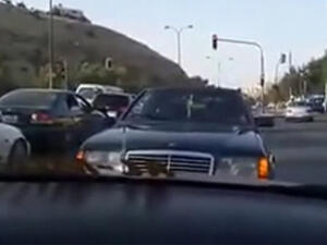 A video circulating on social media shows a black Mercedes driving backwards on a busy street in Amman for 600 meters. (YouTube)
