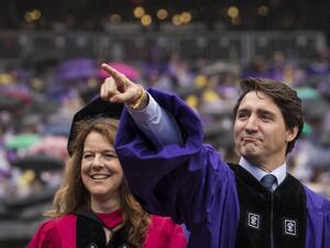 Canadian Prime Minister Justin Trudeau gestures as he arrives for New York University's commencement ceremony/AFP