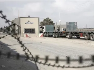 A truck is seen at the gate of Kerem Shalom crossing, the main passage point for goods entering Gaza, in the town of Rafah, the southern Gaza Strip. (AFP/File)